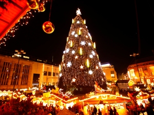 A decorated Christmas tree is lighted up at a Christmas market on its opening day in Dortmund